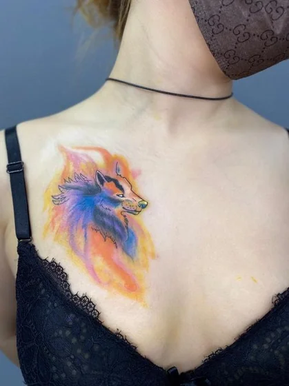 Watercolor wolf tattoo design for women on chest