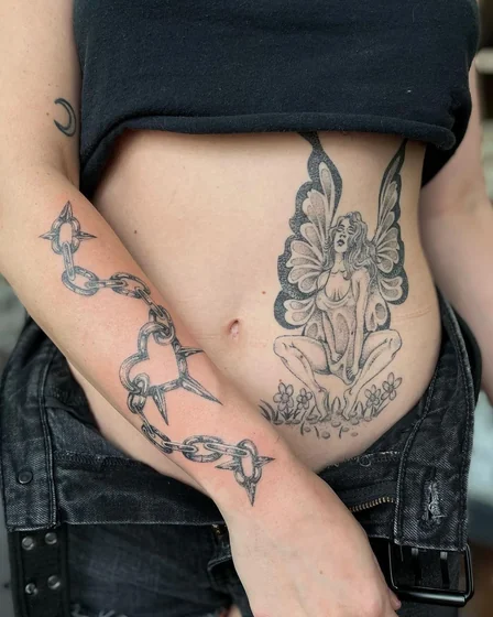 Women's fine line fairy & chain tattoo idea on forearm, hip.